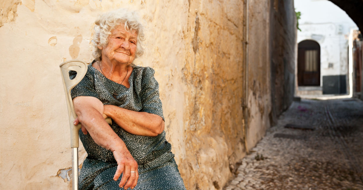 Senior woman soaking up some vitamin D in Greece. Senior woman soaking up some vitamin D in Greece.