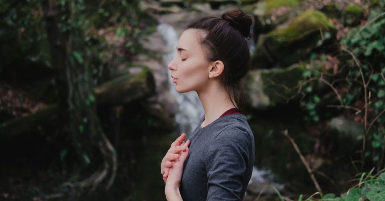 Woman practicing breathing exercises. Woman practicing breathing exercises.