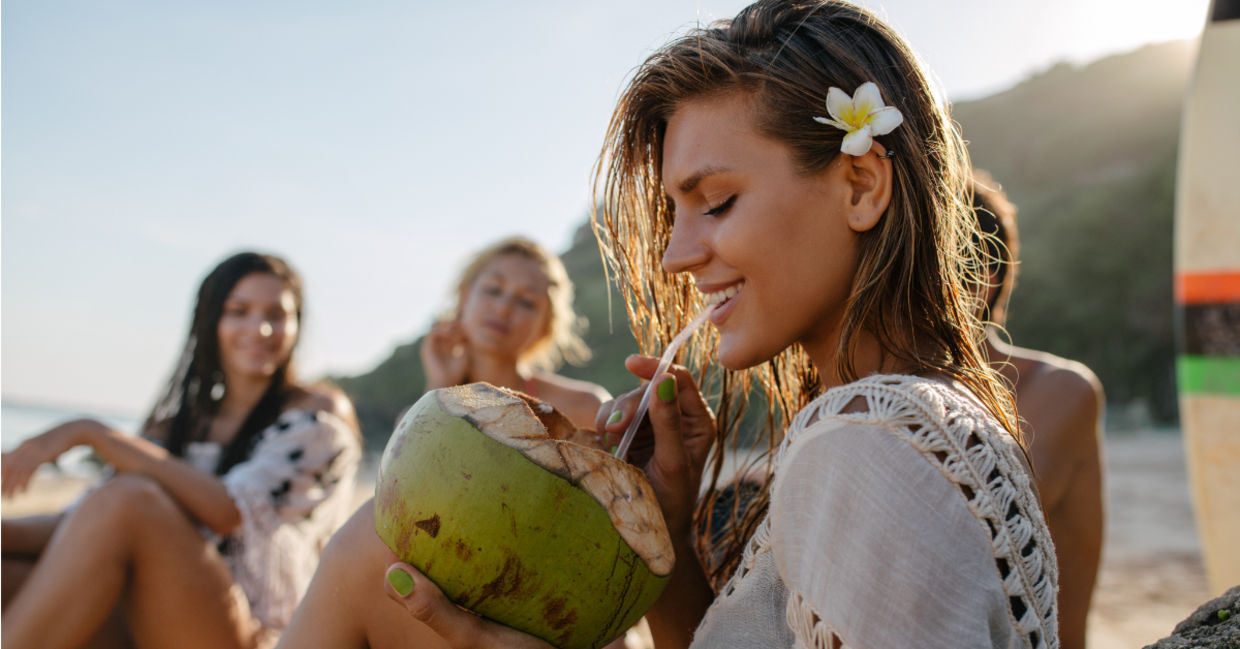 Drinking from a coconut. Drinking from a coconut.