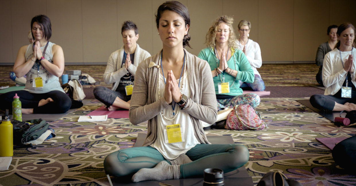 a yoga class in the easy pose. a yoga class in the easy pose.