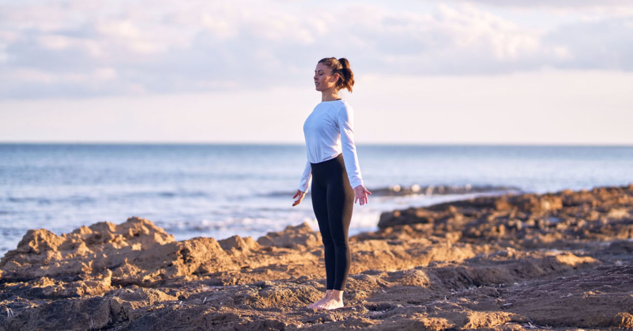 A woman performing the mountain yoga pose. A woman performing the mountain yoga pose.