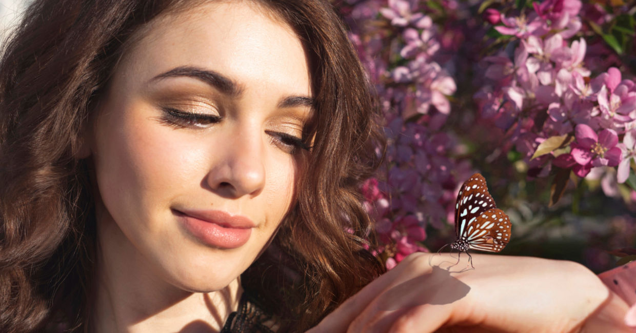 Woman holding a butterfly. Woman holding a butterfly.