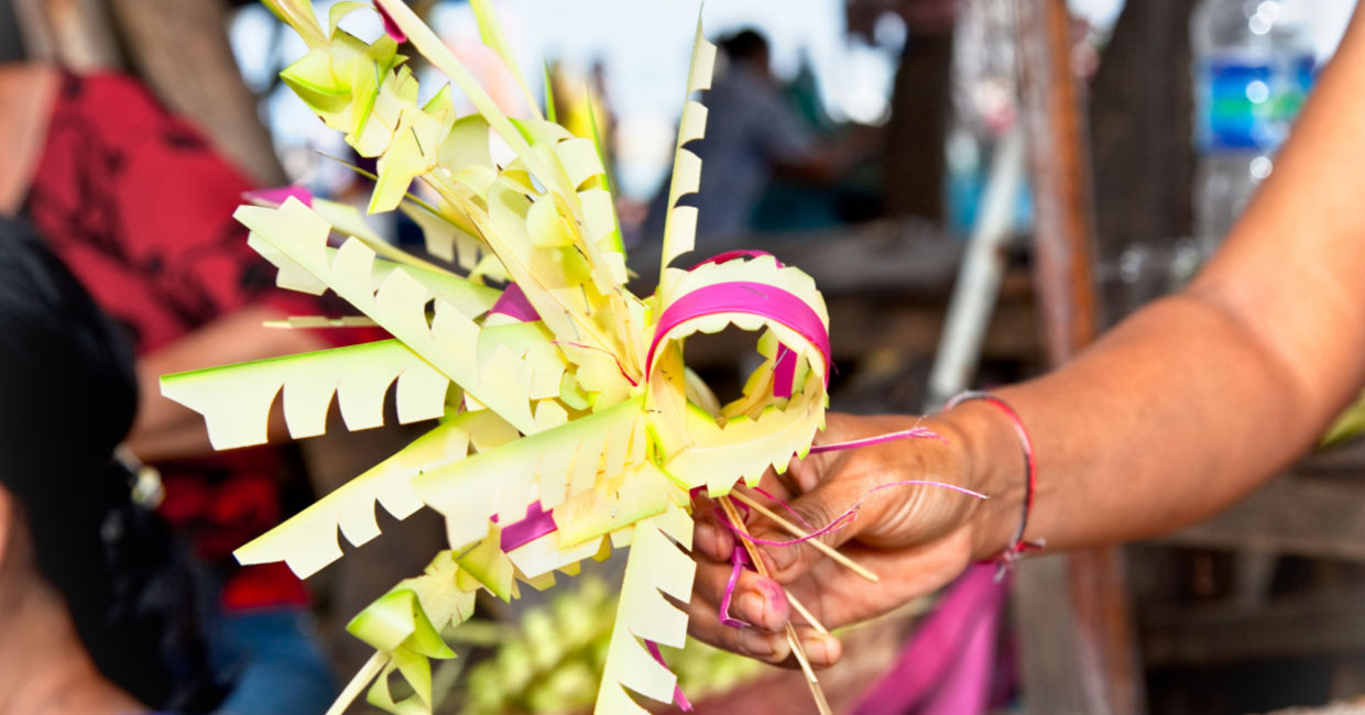 Woman weaving a Canang Sari. Woman weaving a Canang Sari.