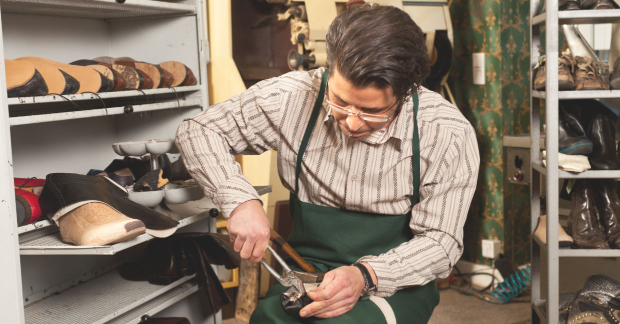 Shoemaker at work. Shoemaker at work.