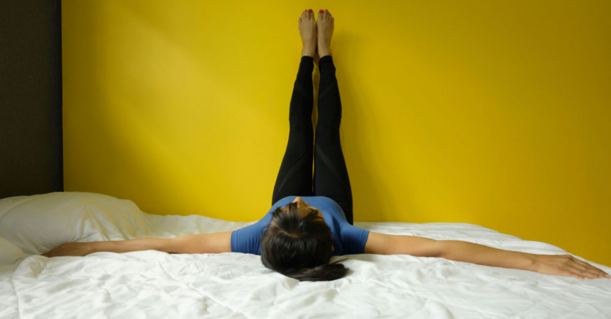 Starting the morning with the legs-up-the-wall yoga pose. Starting the morning with the legs-up-the-wall yoga pose.
