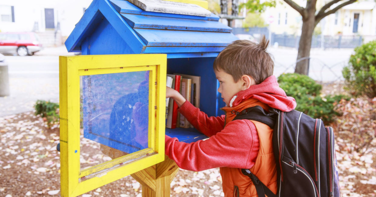 Bringing books to a Little Free Library. Bringing books to a Little Free Library.