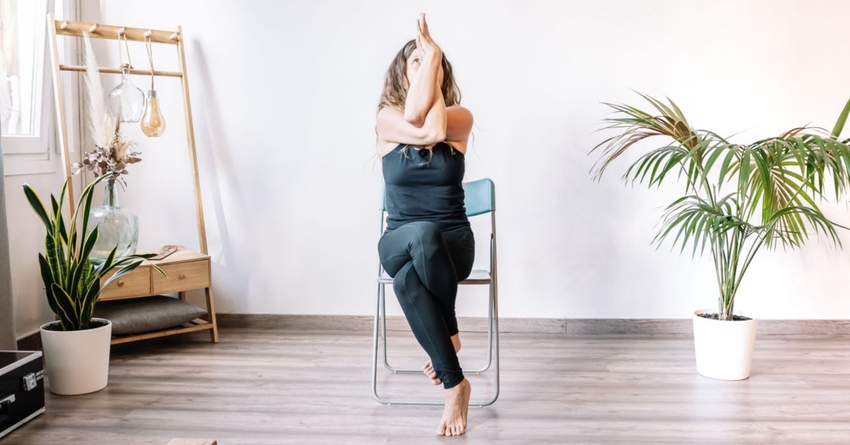 woman in the seated eagle chair yoga pose. woman in the seated eagle chair yoga pose.