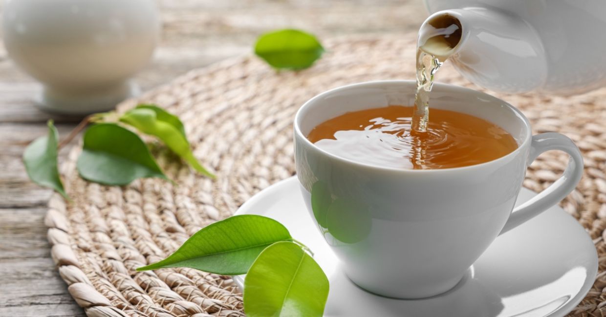 Pouring a cup of green tea. Pouring a cup of green tea.