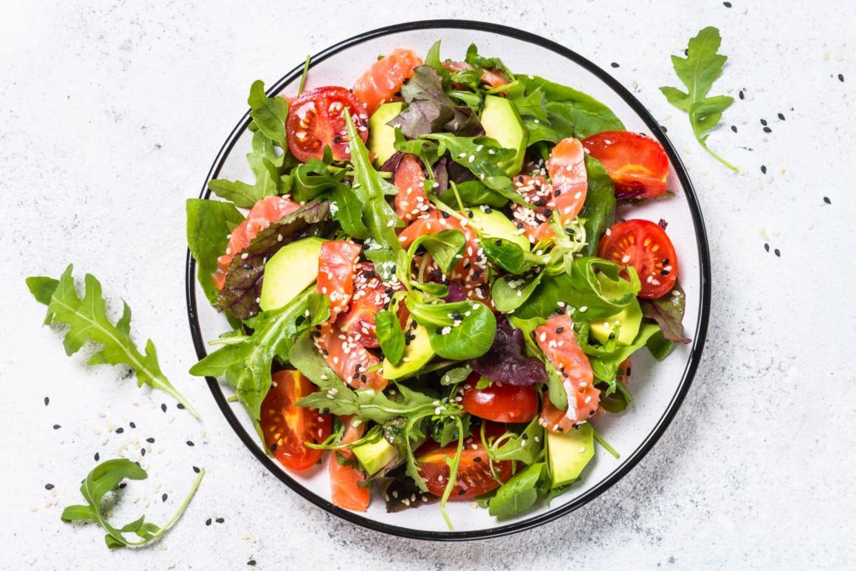 Salmon, avocado, and tomato salad is good for your health. Salmon, avocado, and tomato salad is good for your health.