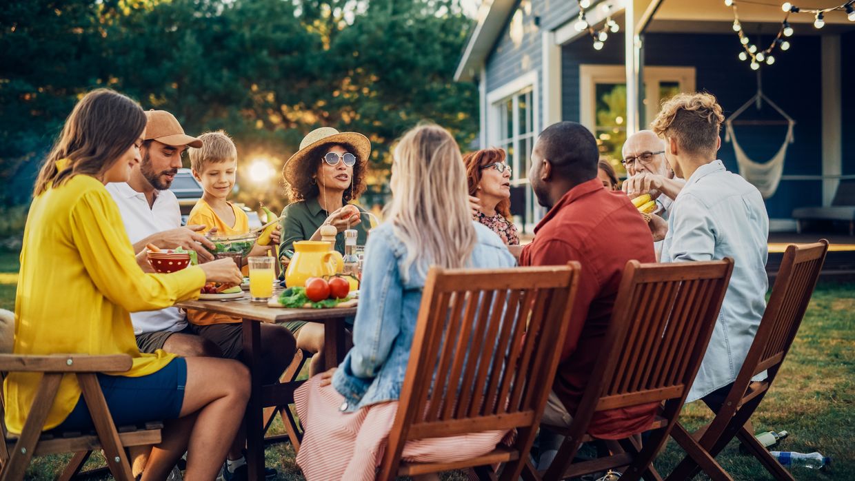 Enjoying a summer dinner outdoors. Enjoying a summer dinner outdoors.