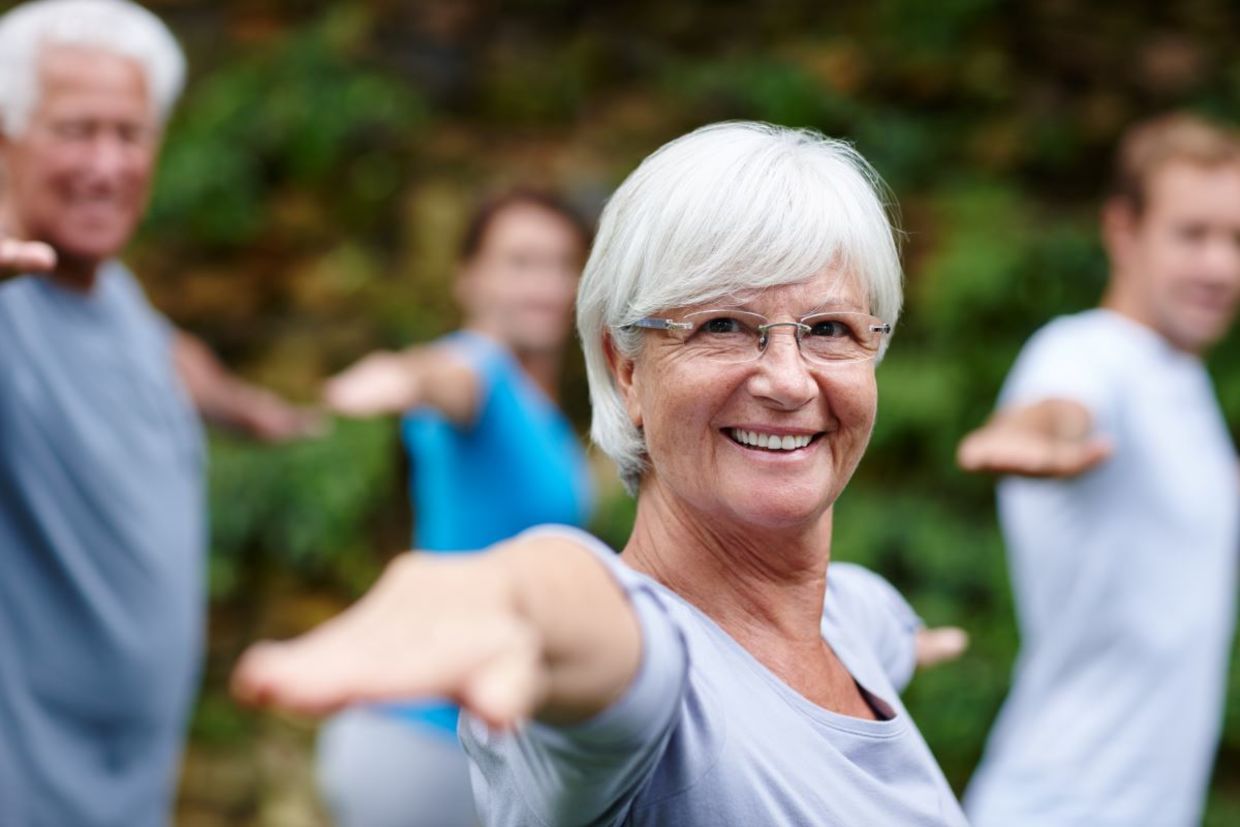 Seniors in a yoga class. Seniors in a yoga class.
