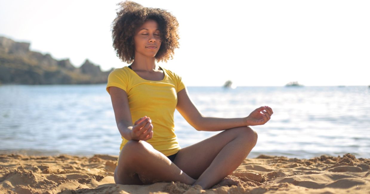 Doing yoga on a beach. Doing yoga on a beach.