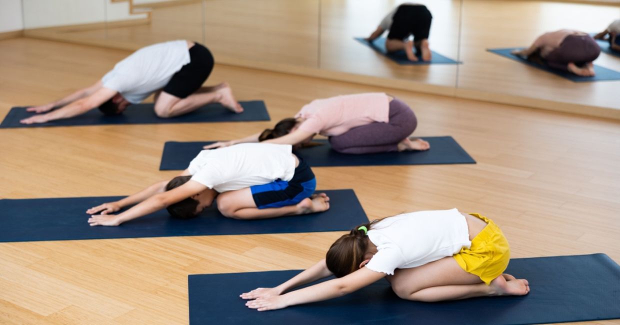 Parents and tweens doing yoga. Parents and tweens doing yoga.