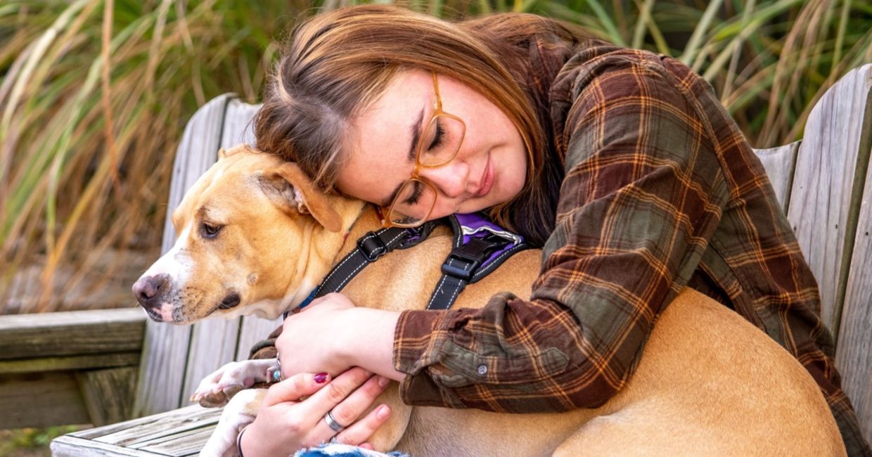 A woman with her therapy dog. A woman with her therapy dog.