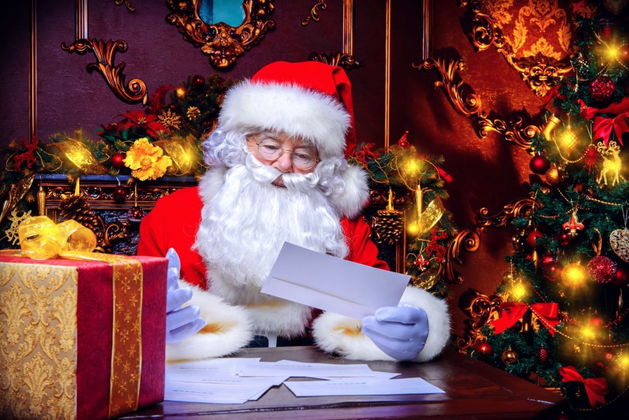 Santa reading a letter. Santa reading a letter.