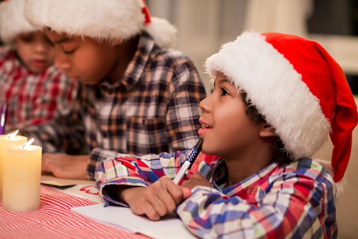 Writing a Christmas letter. Writing a Christmas letter.