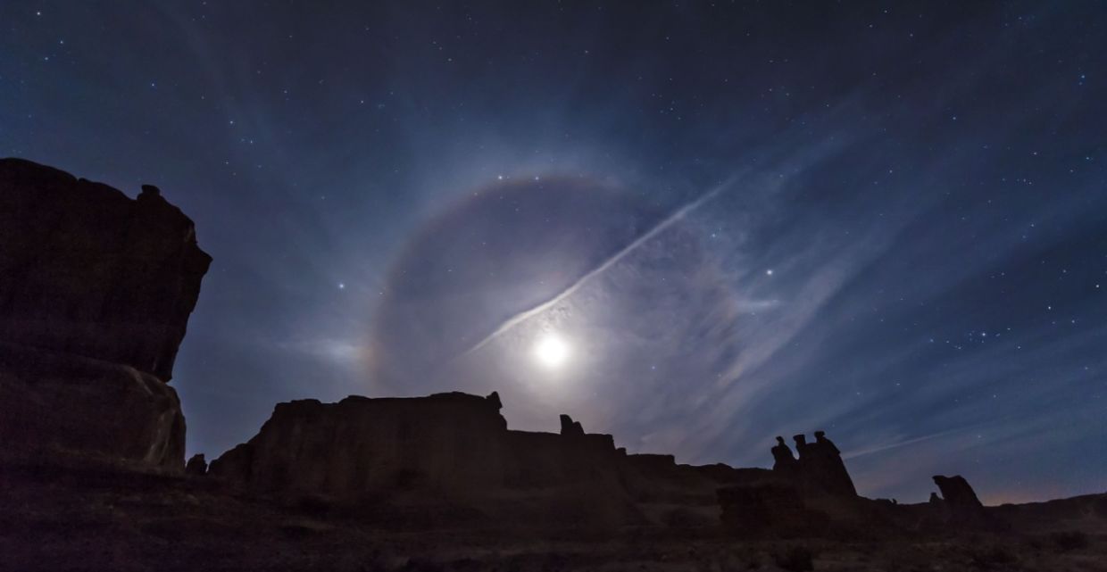 A moon halo over Arches National Park. A moon halo over Arches National Park.