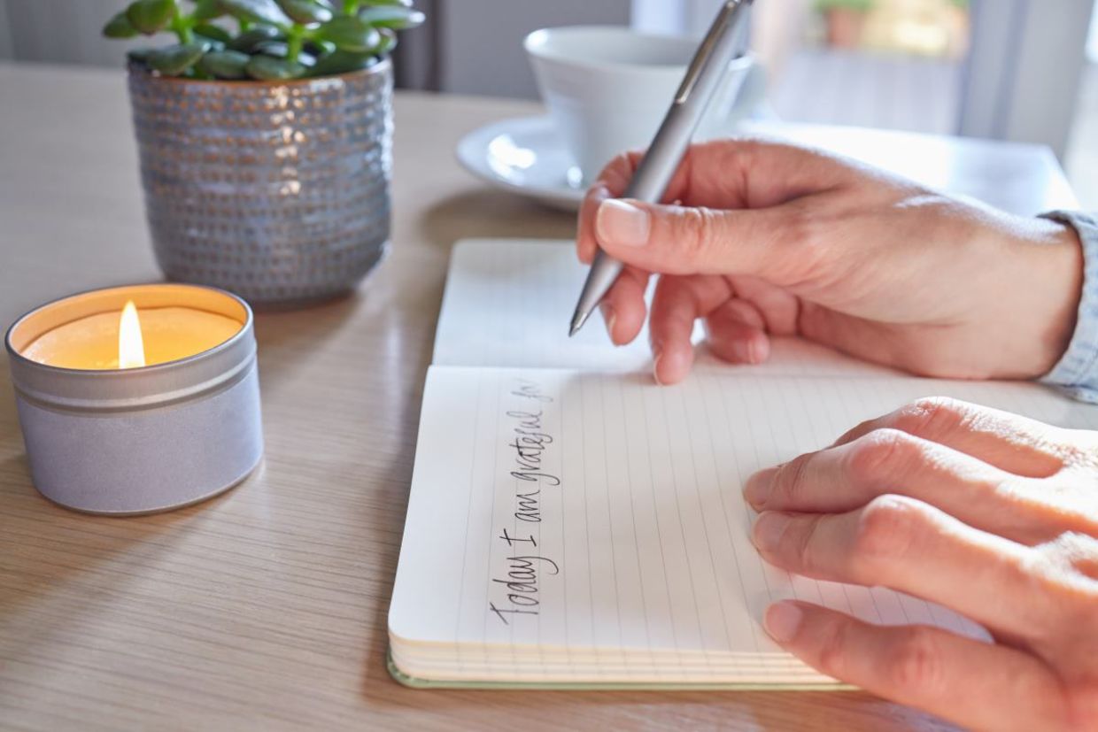 Writing a gratitude journal. Writing a gratitude journal.