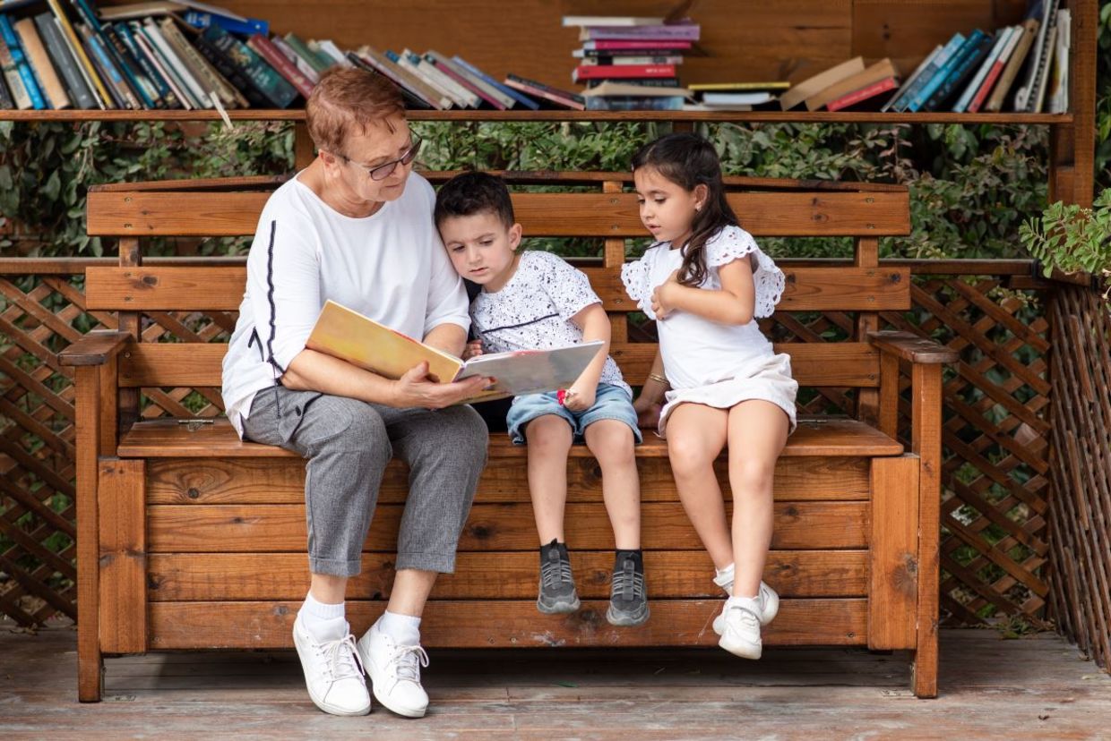 Grandmother reading to her grandchildren. Grandmother reading to her grandchildren.