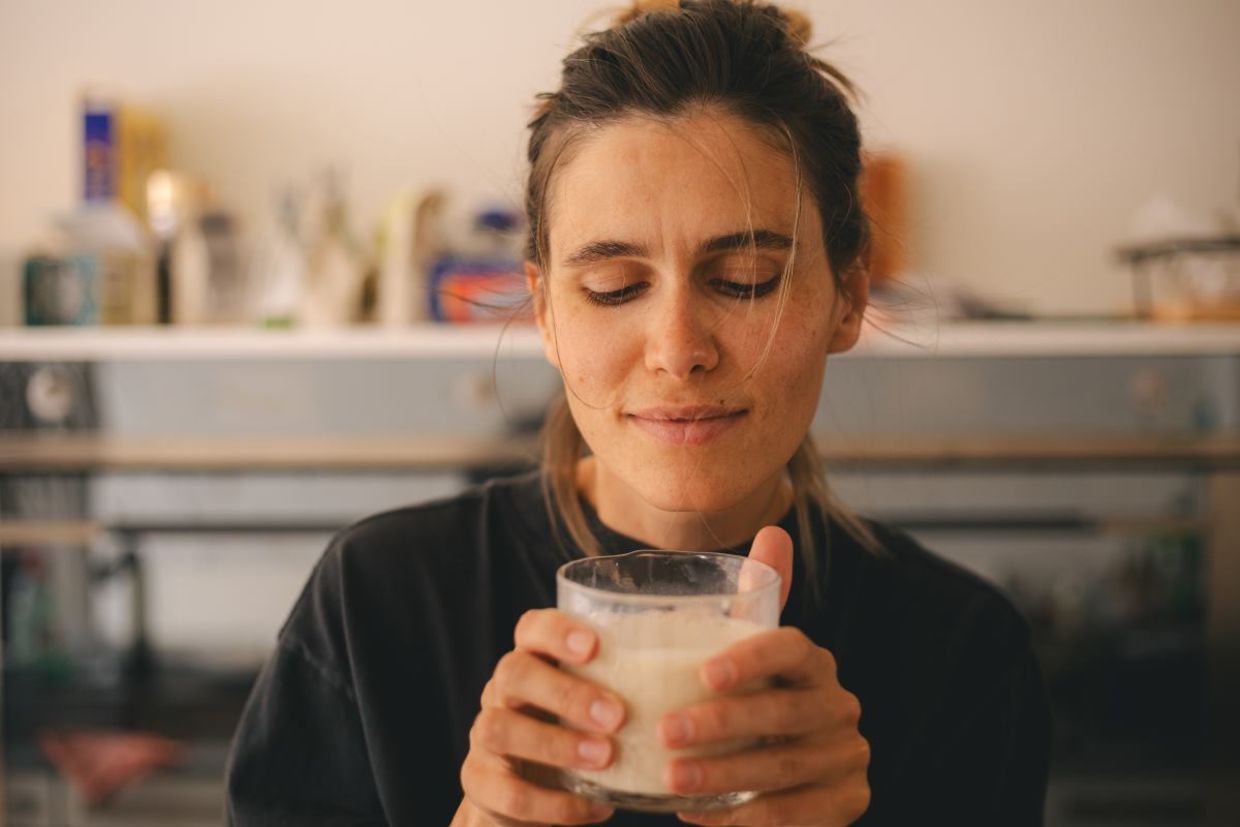 Enjoying a cup of warm milk before bed helps you sleep better. Enjoying a cup of warm milk before bed helps you sleep better.