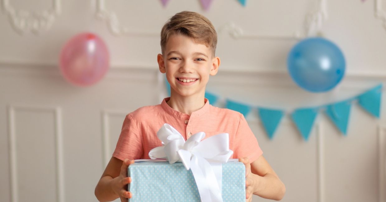 Cute boy bearing a gift. Cute boy bearing a gift.