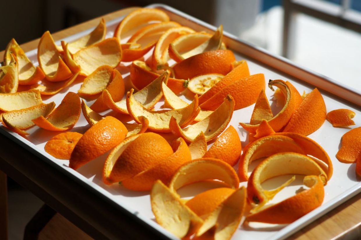 Making candied orange peels. Making candied orange peels.