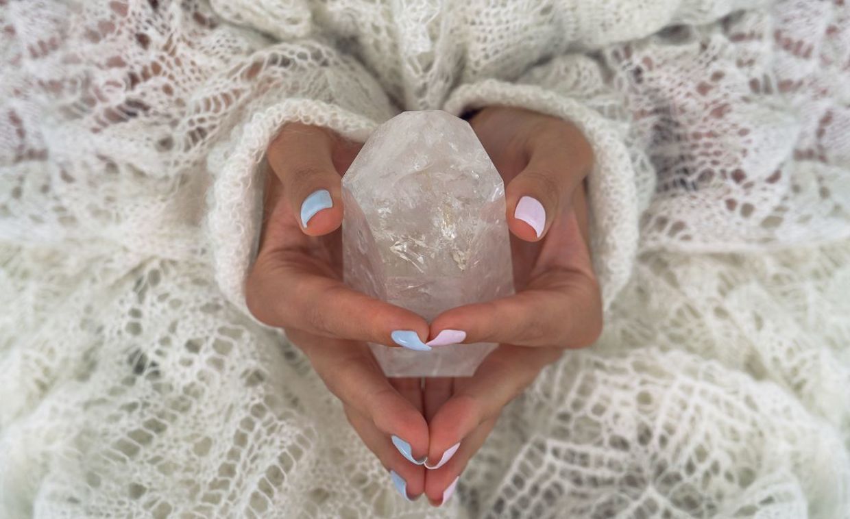 Meditating with a healing crystal. Meditating with a healing crystal.