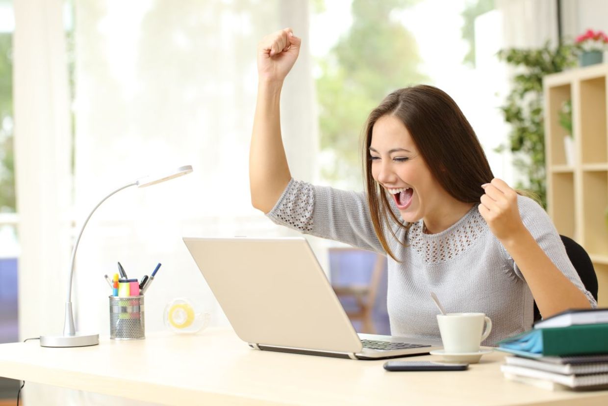 This woman is celebrating a success. This woman is celebrating a success.
