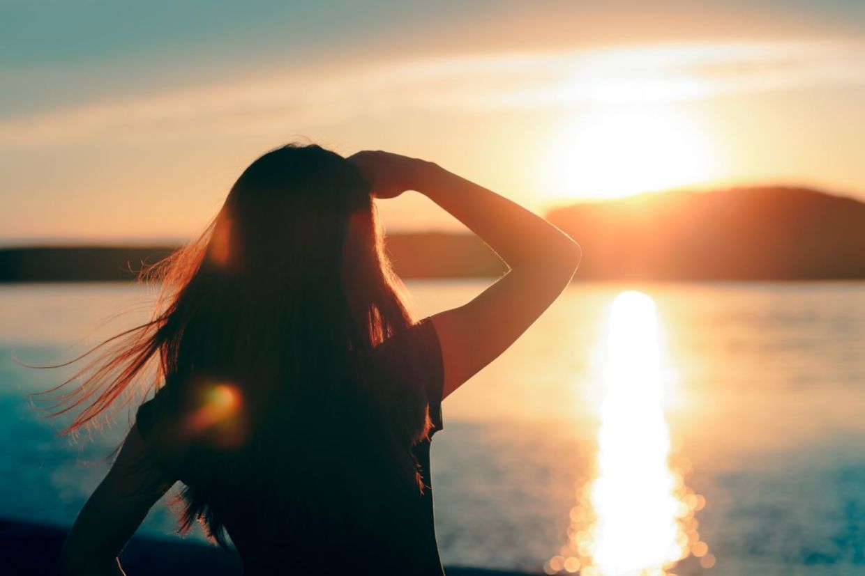 Hopeful woman looking towards the future. Hopeful woman looking towards the future.