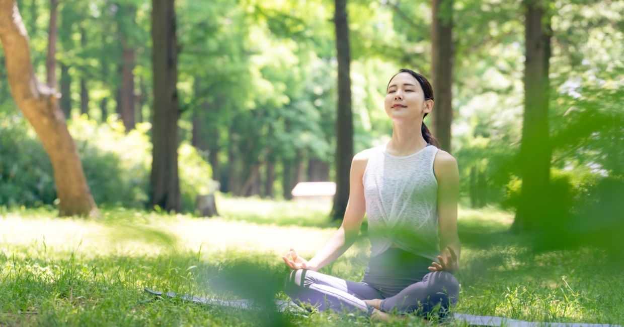 Woman meditating in nature. Woman meditating in nature.