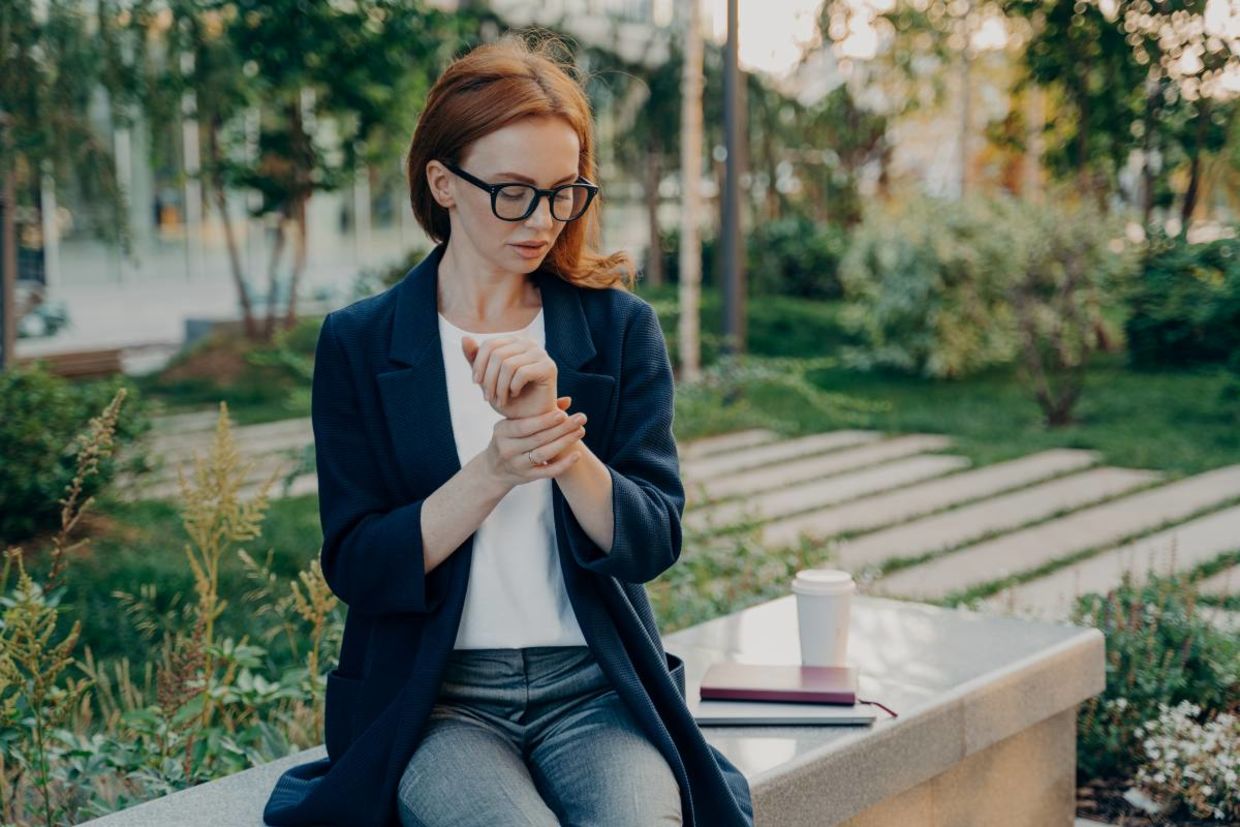 A woman checking her heart rate. A woman checking her heart rate.