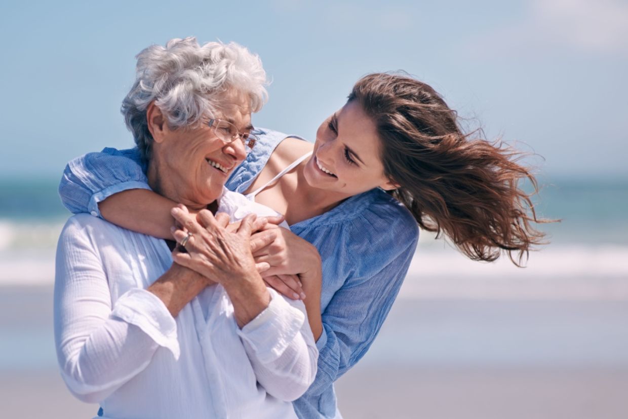 A daughter hugs her mother. A daughter hugs her mother.